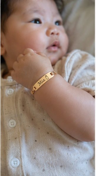 Baby wearing Mia personalized bracelet