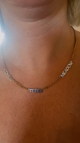 Customer wearing family names from Jewelry Handcrafts