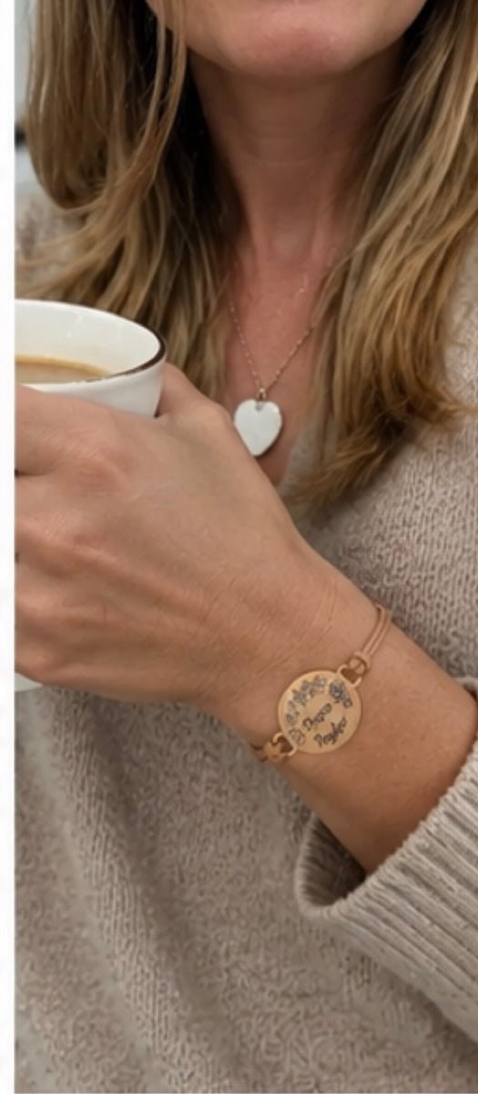 Customer wearing personalized mom birthstone bracelet while holding coffee