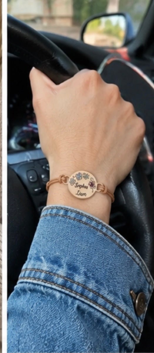 Customer wearing personalized kids birthstone bracelet in car