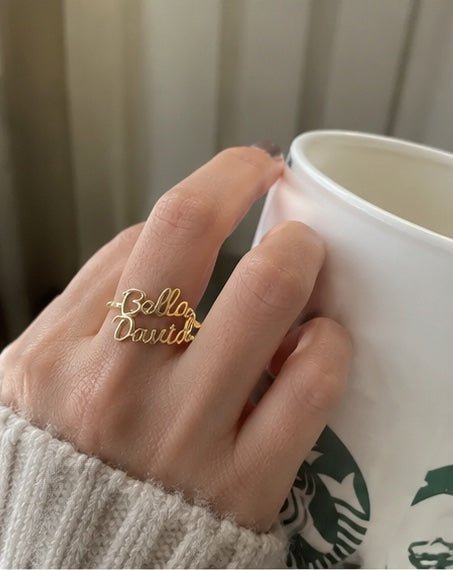 Customer wearing personalized two name ring mirror photo