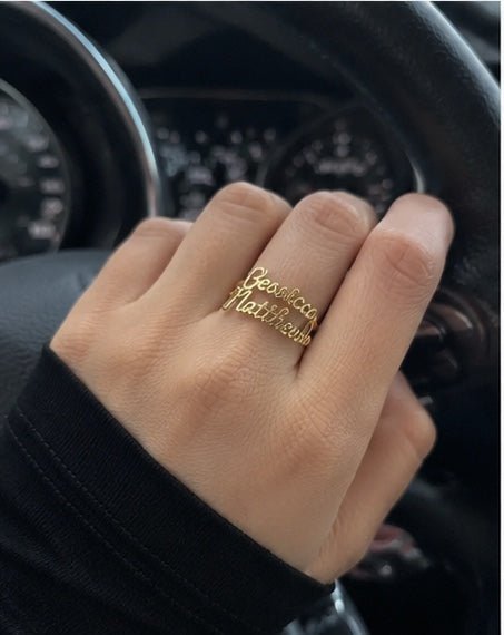 Customer wearing custom ring while reading