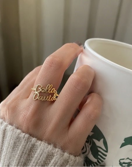 Customer wearing personalized two name ring mirror photo
